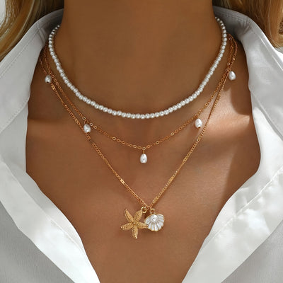 אלינור | שרשרת בסגנון חוף עם תליון צדף וכוכב ים בעיצוב יוקרתי