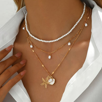 אלינור | שרשרת בסגנון חוף עם תליון צדף וכוכב ים בעיצוב יוקרתי