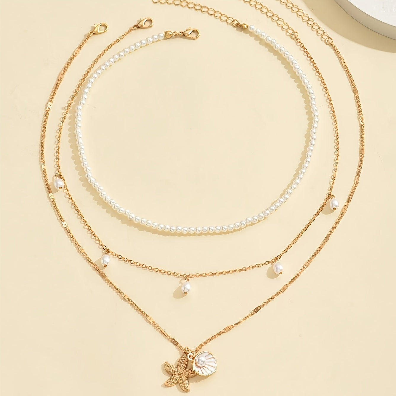 אלינור | שרשרת בסגנון חוף עם תליון צדף וכוכב ים בעיצוב יוקרתי